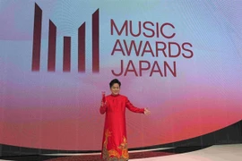 Tung Duong wears ao dai to receive the International Special Award at MAJ 2025 in Kyoto, Japan. (Photos courtesy of MAJ)