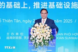 Prime Minister Pham Minh Chinh addresses the Vietnam-China business forum. (Photo: VNA)