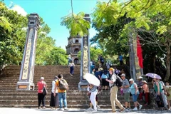Tourists visit Thien Mu pagoda in Hue. (Photo: VNA)