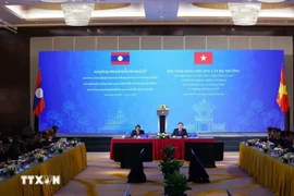 At a bilateral ministerial meeting to enhance cooperation in combating crimes, maintaining social order, and tackling drug-related issues between the Vietnamese and Lao Ministries of Public Security in Hanoi on October 14. (Photo: VNA)