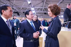 Prime Minister Pham Minh Chinh (centre) meets with UNESCO Director-General Audrey Azoulay on June 9. (Photo: VNA)